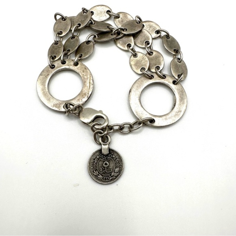 Silver circle dangle link bracelet with a coin charm